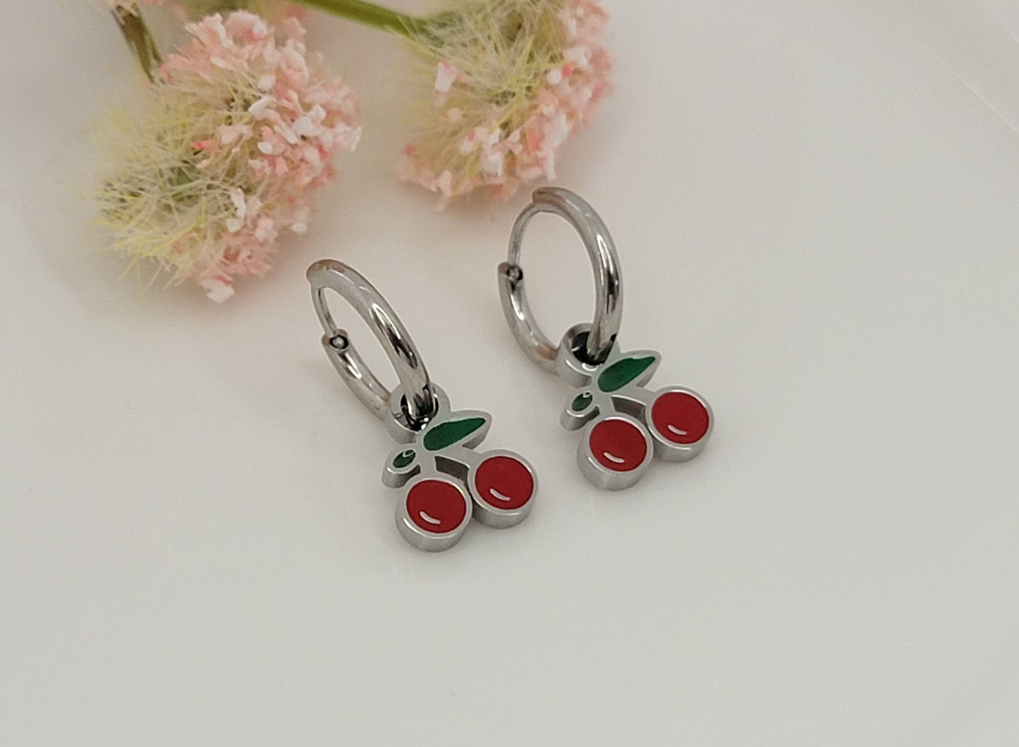 CHERRY HUGGIE HOOP WATERPROOF SS EARRINGS.