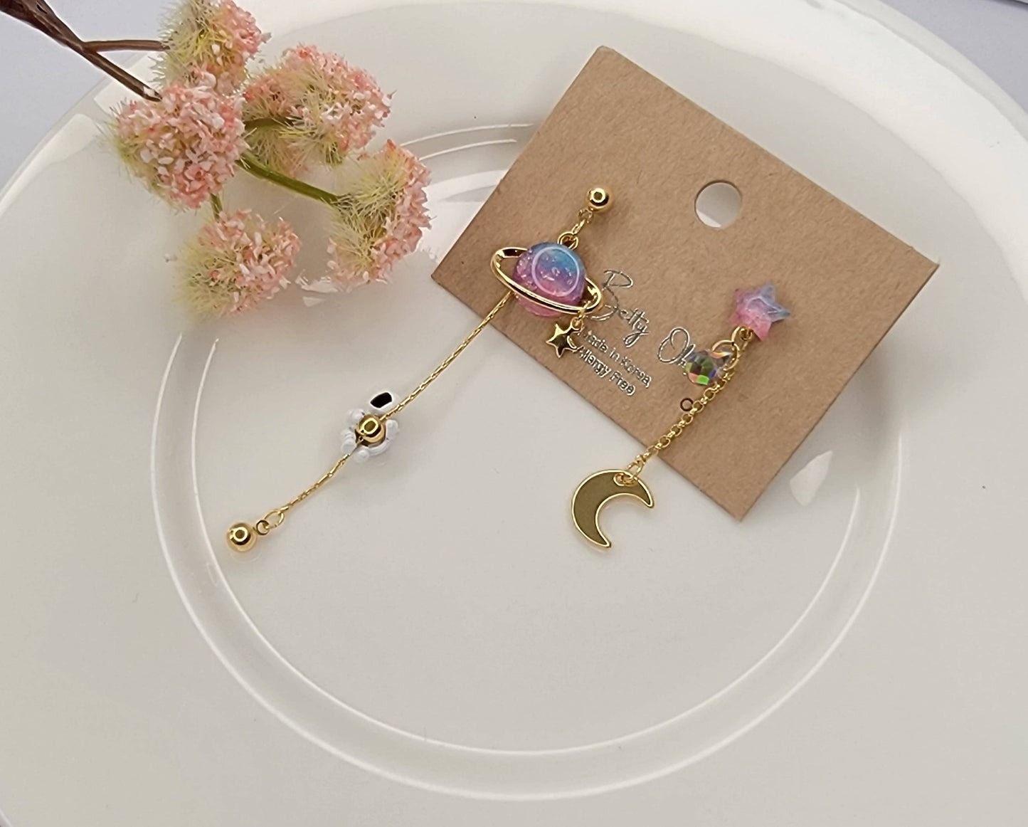 ASTRONAUT EARTH MOON AND STAR UNBALANCED DANGLE EARRINGS.