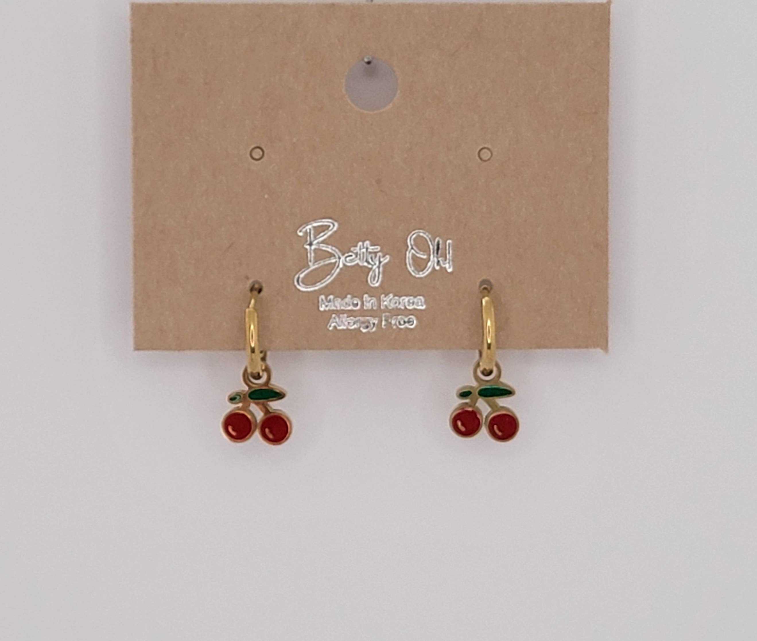 CHERRY HUGGIE HOOP WATERPROOF SS EARRINGS.