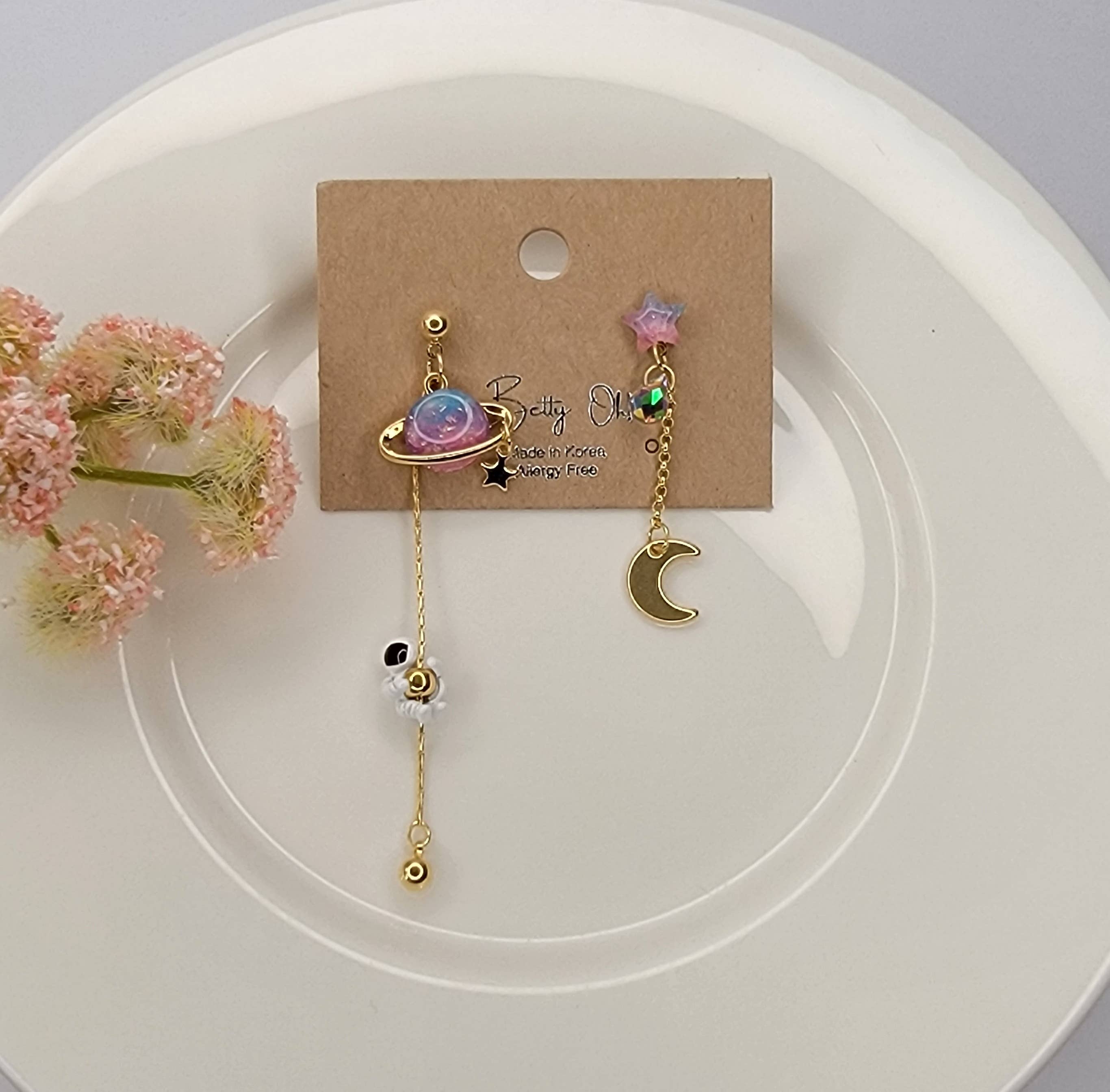 ASTRONAUT EARTH MOON AND STAR UNBALANCED DANGLE EARRINGS.