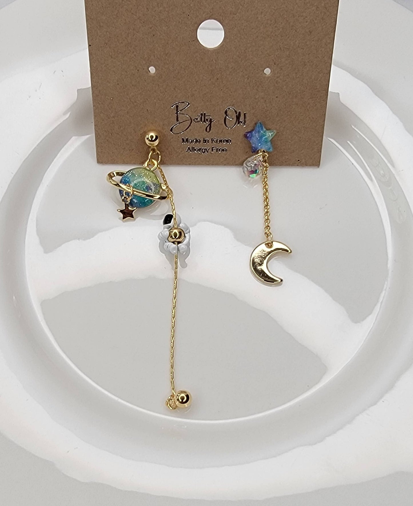ASTRONAUT EARTH MOON AND STAR UNBALANCED DANGLE EARRINGS.