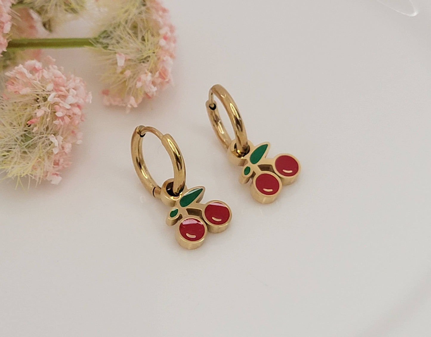 CHERRY HUGGIE HOOP WATERPROOF SS EARRINGS.