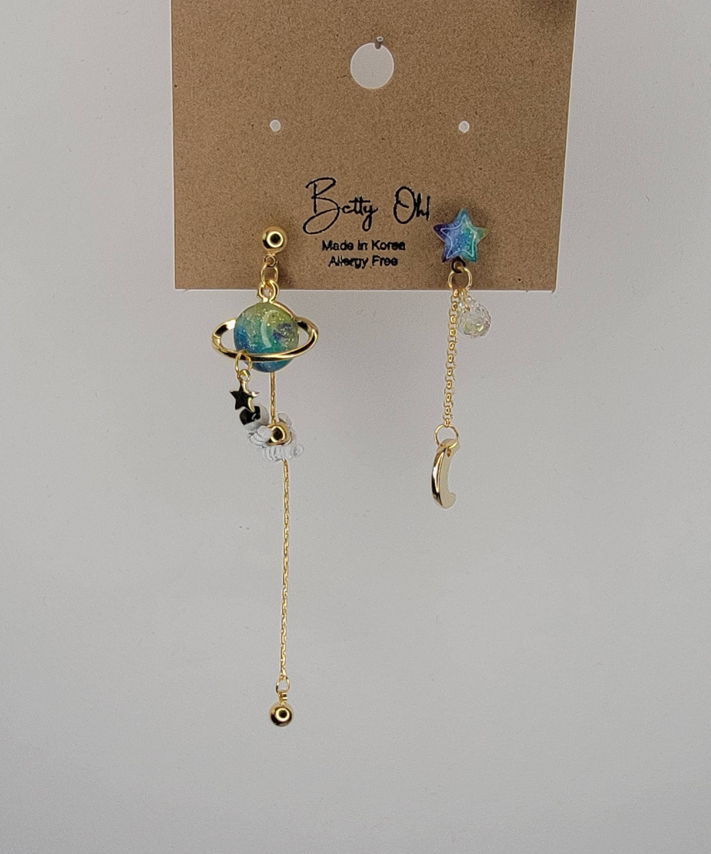 ASTRONAUT EARTH MOON AND STAR UNBALANCED DANGLE EARRINGS.