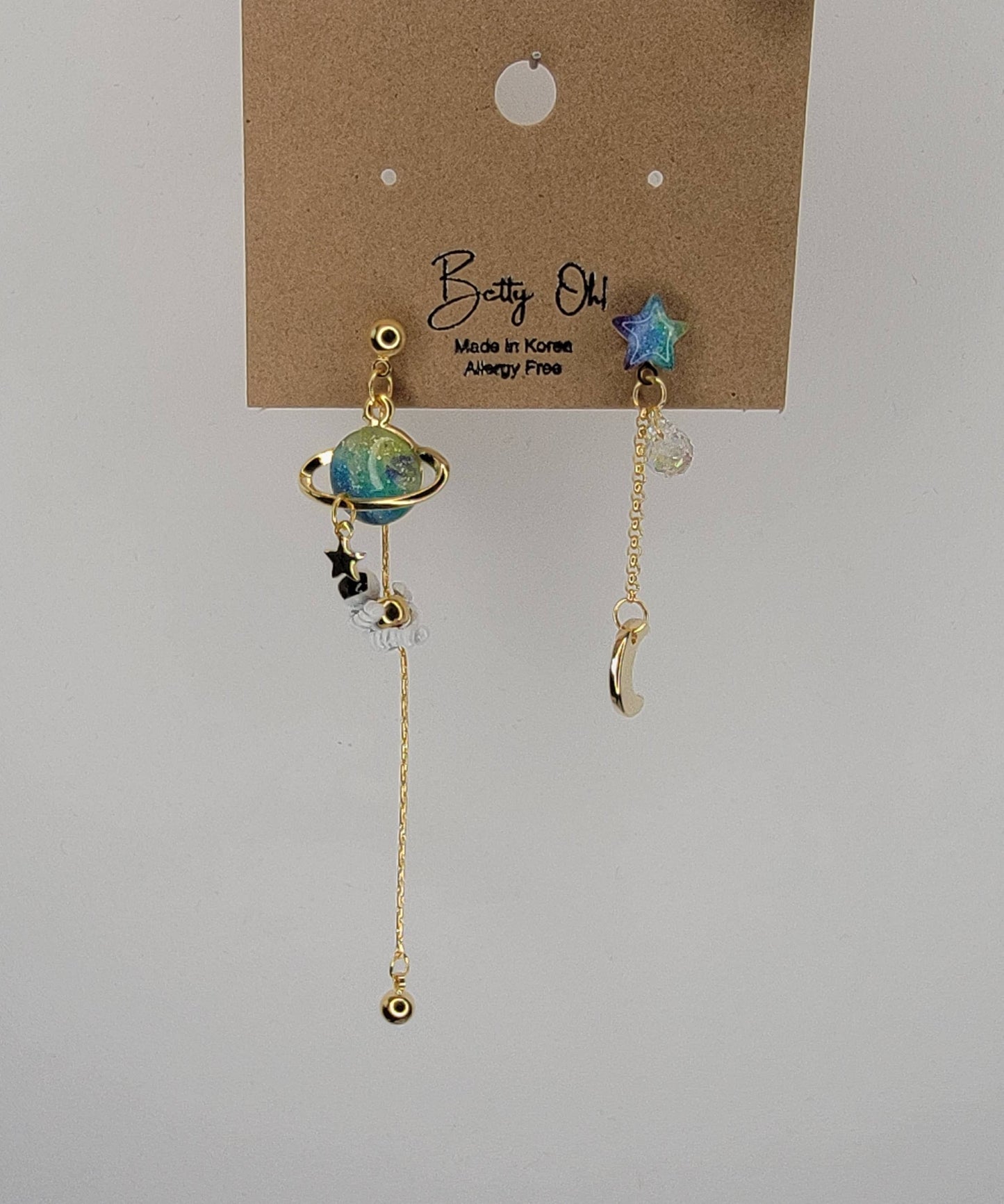 ASTRONAUT EARTH MOON AND STAR UNBALANCED DANGLE EARRINGS.