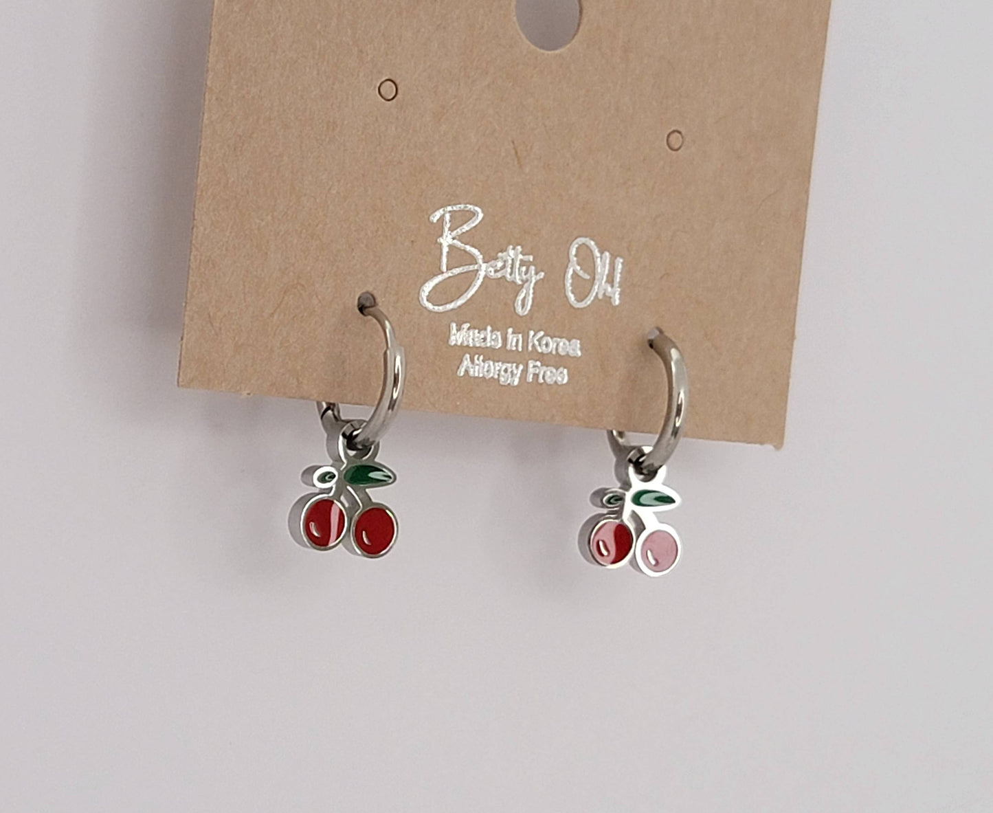 CHERRY HUGGIE HOOP WATERPROOF SS EARRINGS.