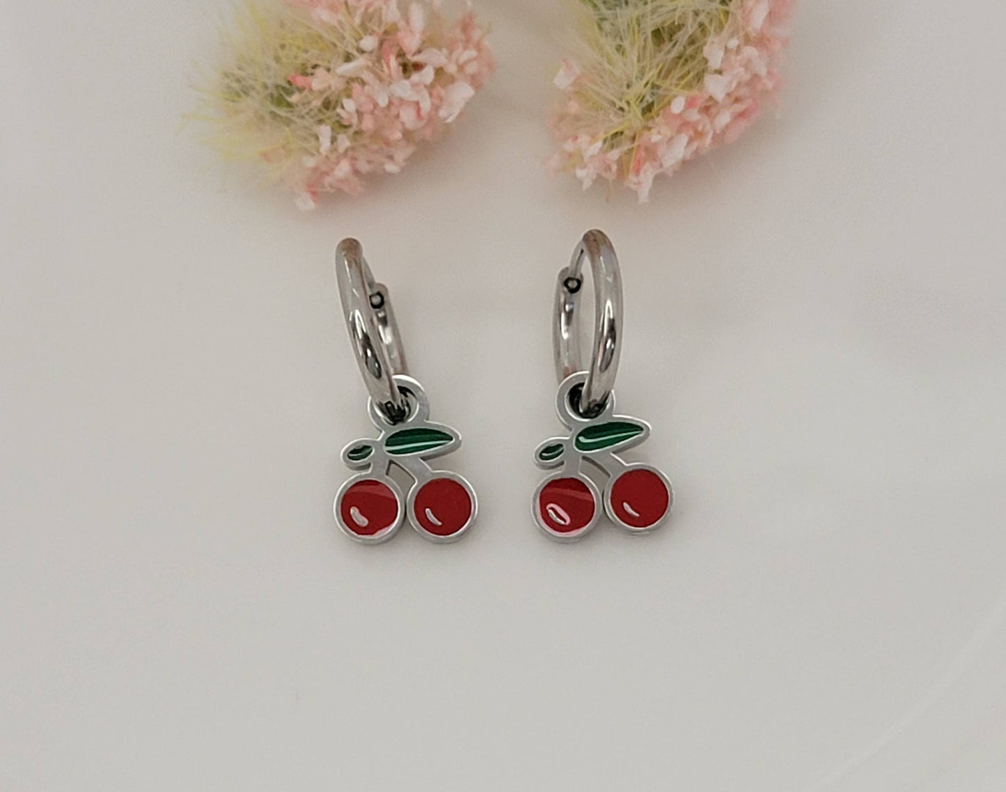 CHERRY HUGGIE HOOP WATERPROOF SS EARRINGS.