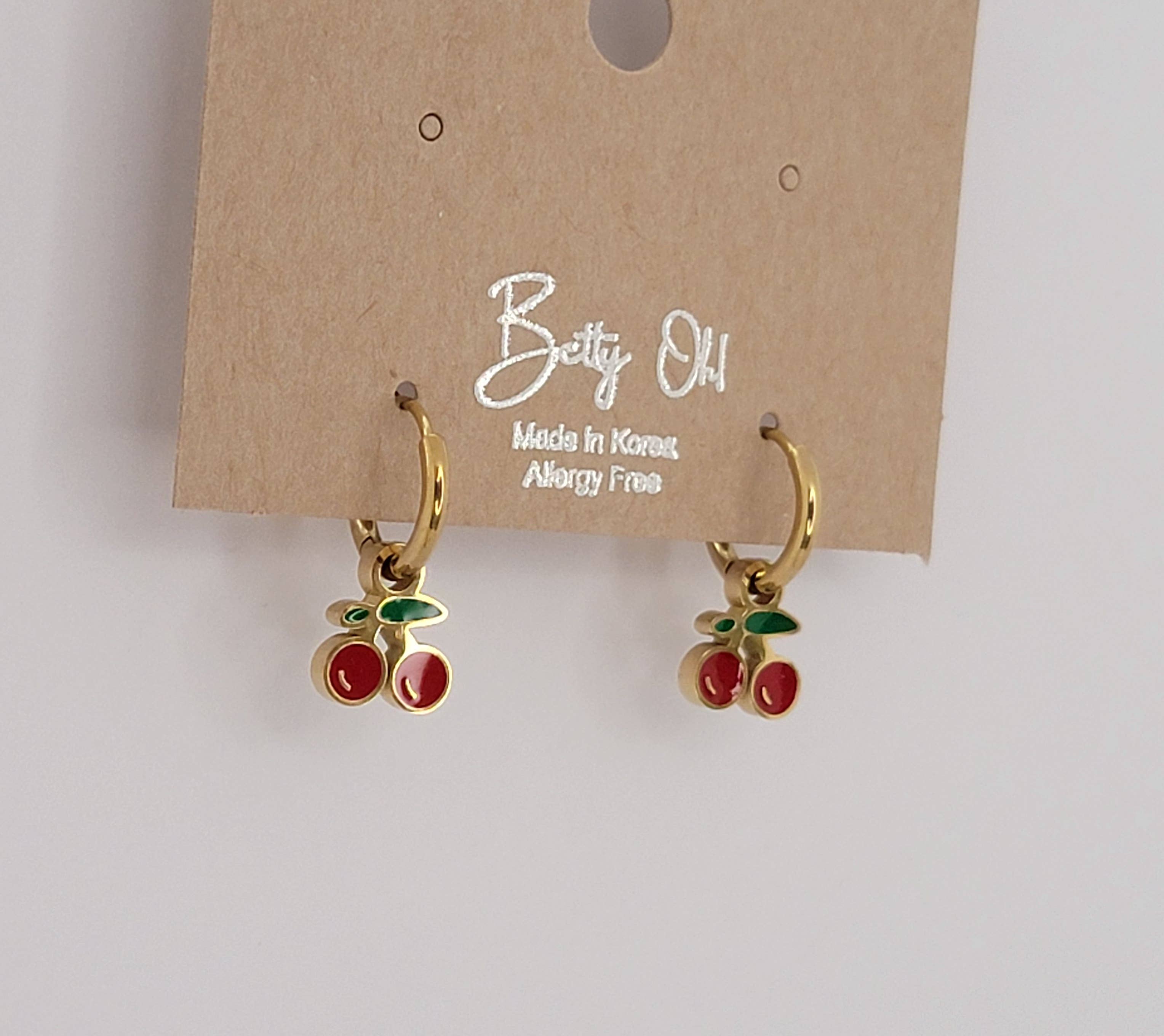CHERRY HUGGIE HOOP WATERPROOF SS EARRINGS.