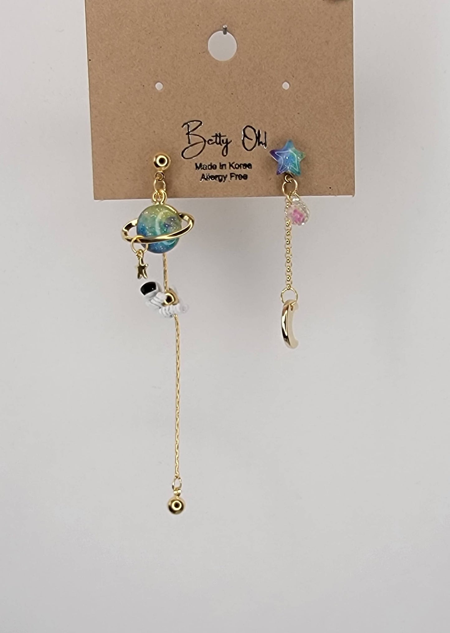 ASTRONAUT EARTH MOON AND STAR UNBALANCED DANGLE EARRINGS.
