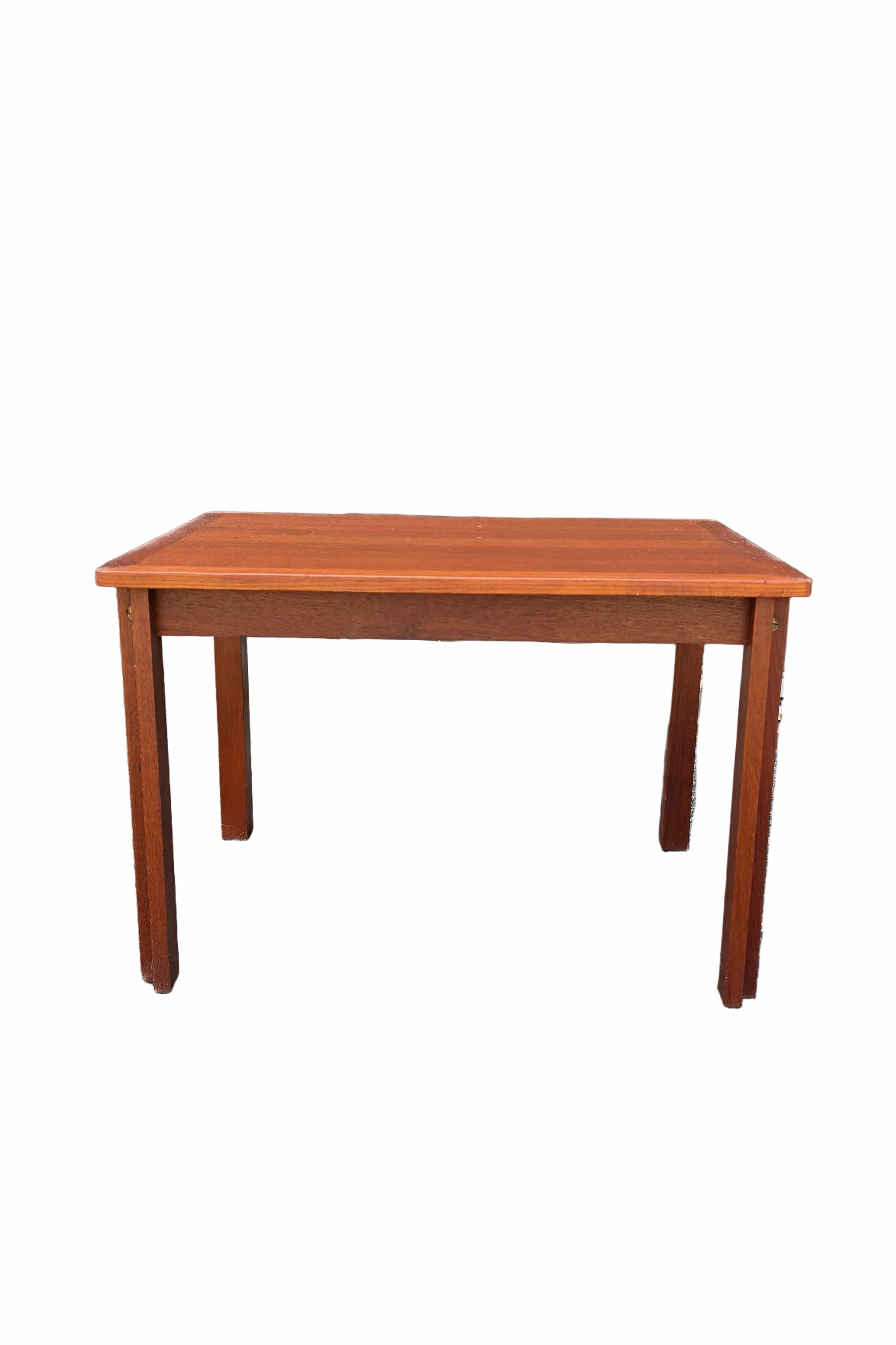 A rectangular wooden table with a warm reddish-brown finish and four legs, shown against a plain white background.